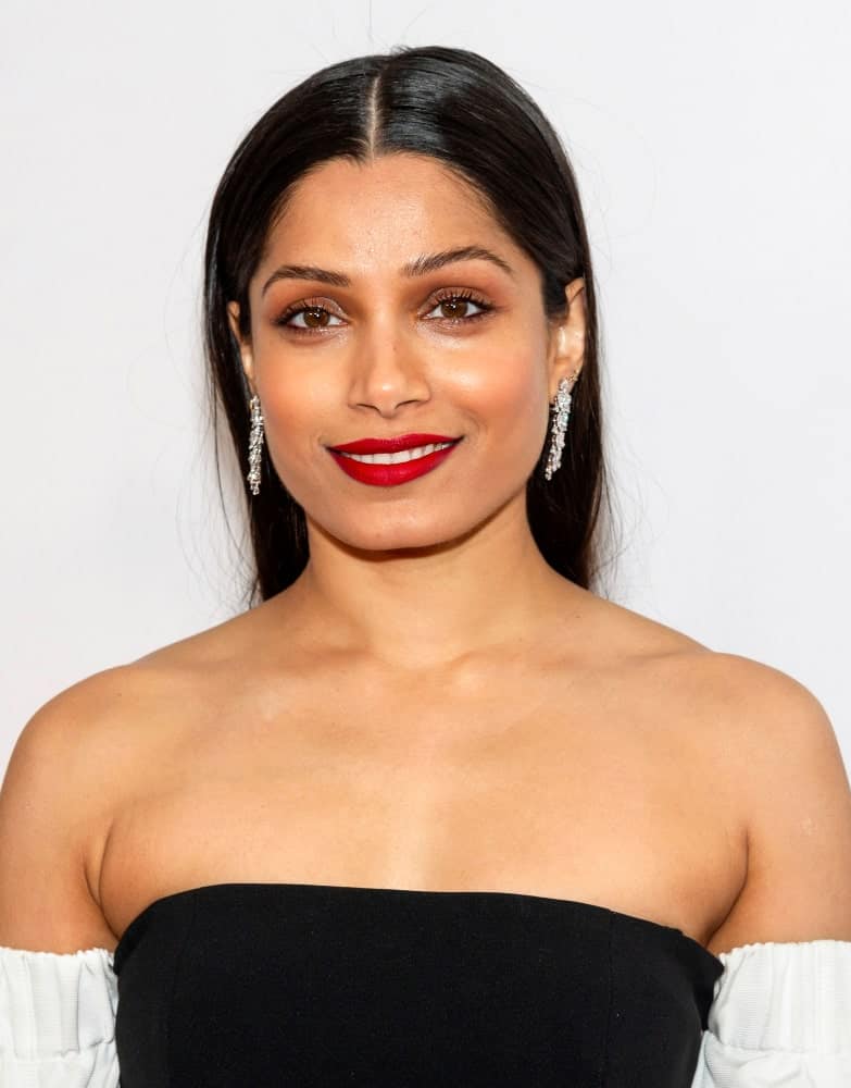 Last April 27, 2019, Freida Pinto attended the World premiere of "Only" during the 2019 Tribeca Film Festival at SVA Theater with a slick and straight hairstyle parted in the middle to pair her bold lips.