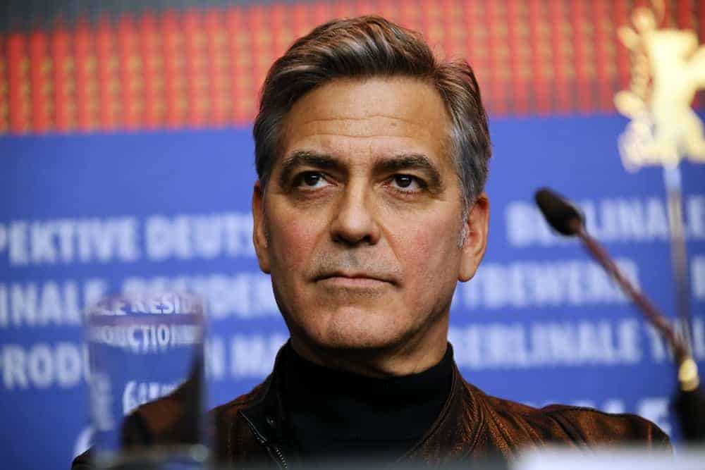 George Clooney attended the 'Hail, Caesar!' press conference during the 66th Berlinale International Film Festival Berlin at Grand Hyatt Hotel on February 11, 2016 in Berlin, Germany. He was seen wearing a leather jacket with his slick and gray pompadour hairstyle.