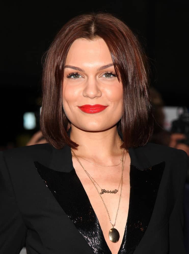 Jessie J attended the 2012 GQ Men Of The Year Awards at the Royal Opera House in London with a sexy smart suit with a deep V design paired with her center-parted long bob hairstyle with reddish highlights.