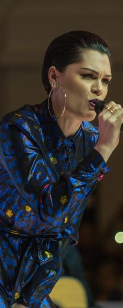 Jessie J. performed at the Dubai Shopping Festival Fashion Show in Mall Of The Emirates on the 20th of January 2017. She rocked the stage with a colorful romper to match her stylish slicked-back pixie hair.