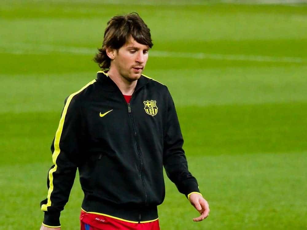 Lionel Messi played during the Spanish Football League match between FC Barcelona and Real Sociedad in Camp Nou Stadium on December 13, 2010 in Barcelona, Spain. He wore a jacket with his long dark hairstyle with bangs.