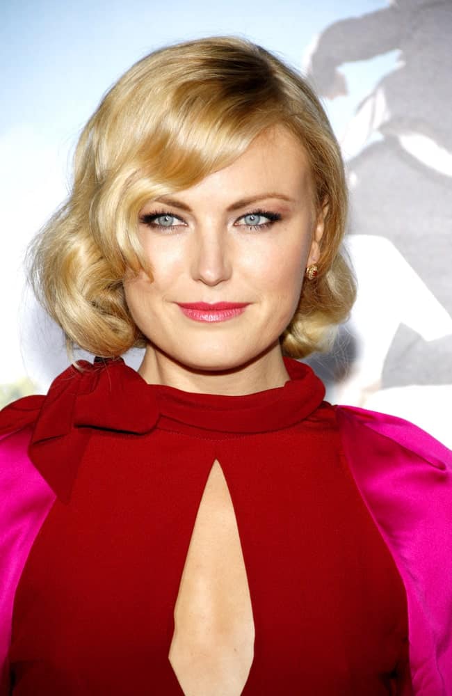 Malin Akerman had a retro look with her colorful dress and curly bob with side-swept bangs at the Los Angeles Premiere of "Wanderlust" held at the Mann Village Theater last February 16, 2012.