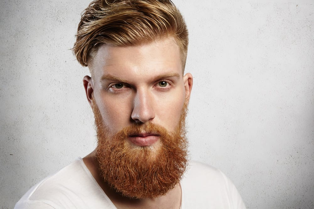 Man with undercut with thick hair and hipster beard