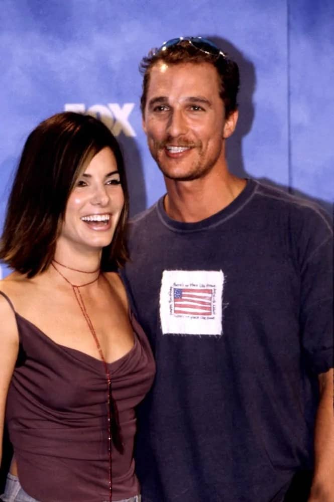 Matthew McConaughey looked casual with his shirt and a short dark crew cut hairstyle when he posed with Sandra Bullocks at the 1999 Teen Choice Awards.