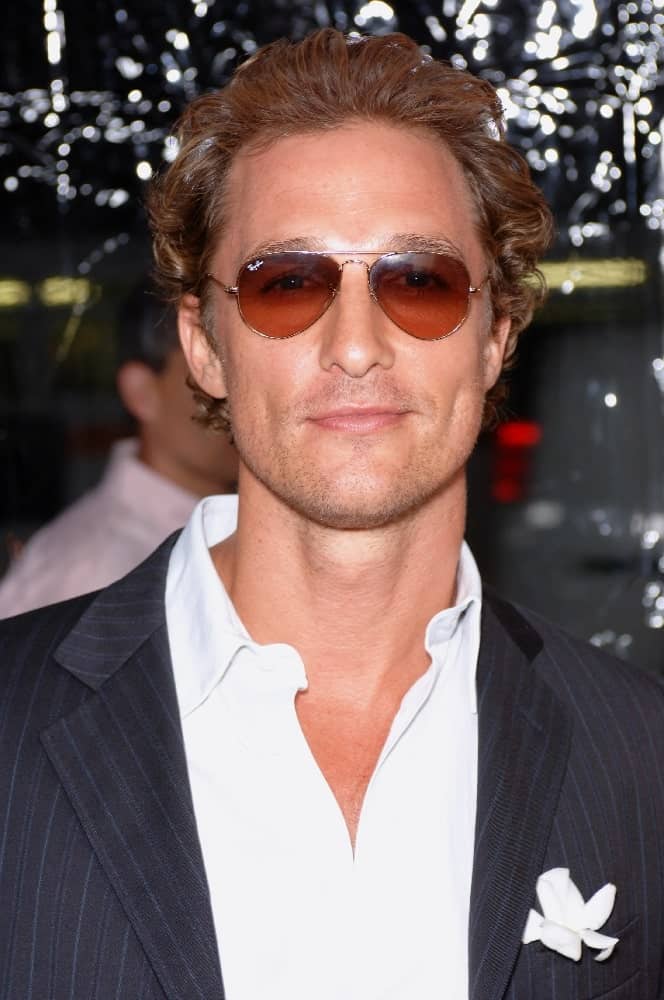 Matthew McConaughey wore dark brown sunglasses at the 2005 world premiere of his movie "Two For The Money" in Beverly Hills. His sunglasses went well with his pin-striped suit and brushed -up curly hair dyed in a reddish brown hue.