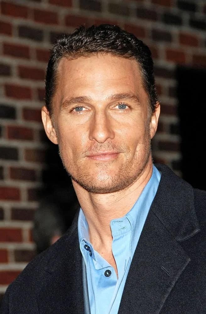 Matthew McConaughey sported a short cropped hair during a talk show appearance at the Late Show with David Letterman paired with his five o'clock shadow and dark suit.