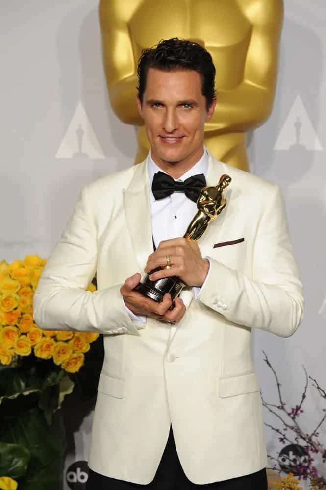 Matthew McConaughey looked positively beaming with pride in a short side swept slick hairstyle while holding his trophy at the 86th Annual Academy Awards held last March 2, 2014.