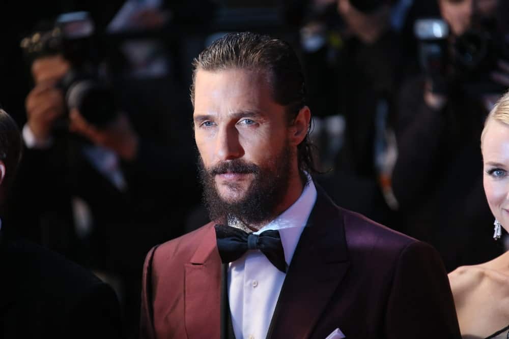 Matthew McConaughey's dark red suit complements his sophisticated slicked-back long wavy hair and thick beard at the premiere of 'The Sea Of Trees' during the 68th annual Cannes Film Festival last May 16, 2015 in Cannes, France.