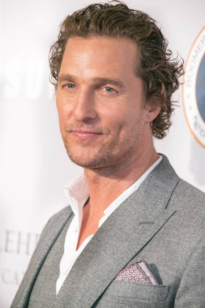 Last September 27, 2018, Matthew McConaughey attended the 17th Annual Samsung Charity Gala wearing a dapper gray suit to match his messy brushed-back dark brown beach waves capped off with five o'clock shadow.