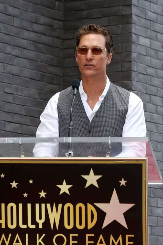 Matthew McConaughey was at the Guy Fieri Star Ceremony on the Hollywood Walk of Fame last May 22, 2019 in Los Angeles with a neat brushed back tame to his dark curls that goes well with his clean-shaved look.