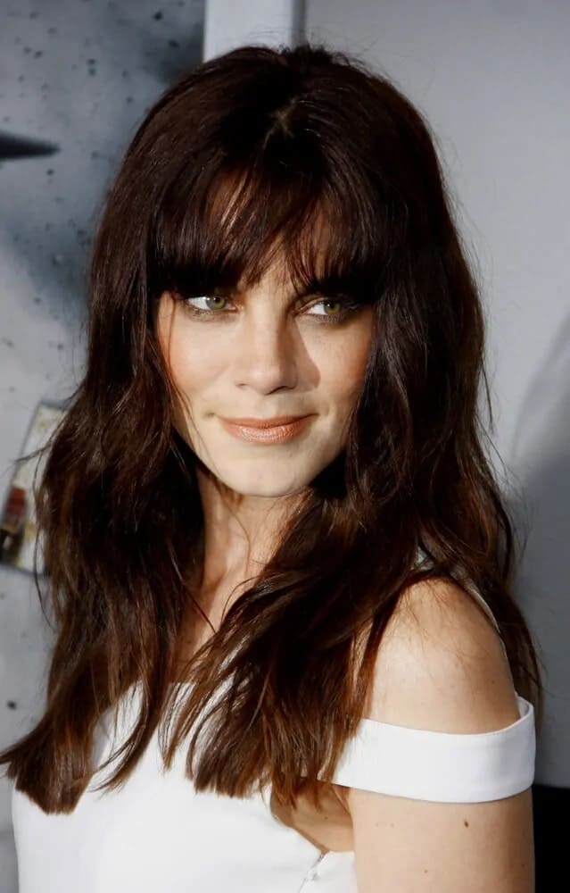 The actress showcased a beautiful and fierce look with her tousled reddish brown waves with bangs just above the eyes for the LA premiere of "Source Code" last March 28, 2011.
