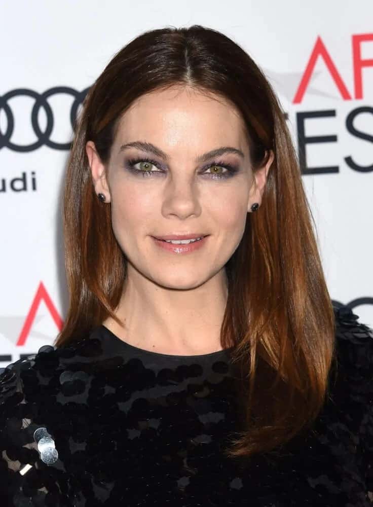 The talented actress wore a black sequined dress that matches her smoky eye shadow and simple mid-parted hairstyle with auburn highlights during the AFI FEST 2016 "Patriots Day" Special Closing Night Gala Presentation.