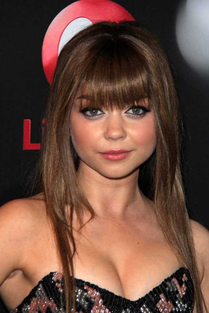 Sarah Hyland was at the "Call Me Crazy: A Five Film" Premiere at the Pacific Design Center on April 16, 2013, in West Hollywood, CA. She was charming in a strapless dress that she paired with a straight medium-length brunette hairstyle incorporated with blunt bangs.