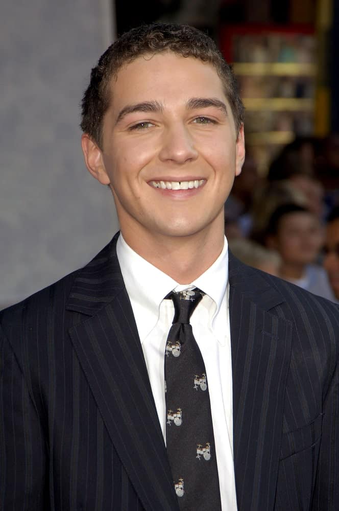Shia LaBeouf brought his adorable smile at the Los Angeles Premiere of "The Greatest Game Ever Played" last September 25, 2005. His dark pinstriped suit matches well with his short curly hair that has a dark brown tone to it.