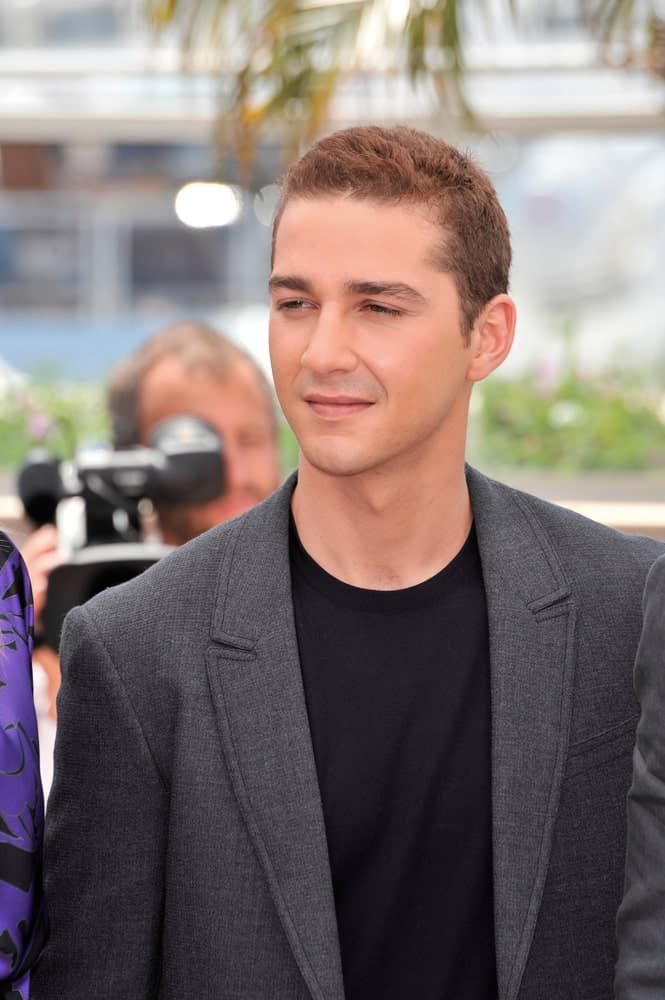 Shia LaBeouf was at the photocall for his movie “Indiana Jones and the Kingdom of the Crystal Skull” at the 61st Annual Cannes Film Festival last May 18, 2008. He was wearing a simple charcoal suit and black shirt to match his highlighted short hair.