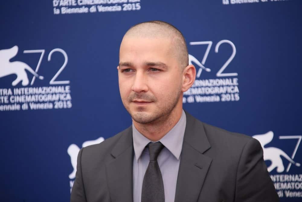 Shia LaBeouf attended the photocall for 'Man Down' during the 72nd Venice Film Festival at on September 6, 2015 in Venice, Italy with a skinhead hairstyle and five o'clock shadow to match his charcoal suit.