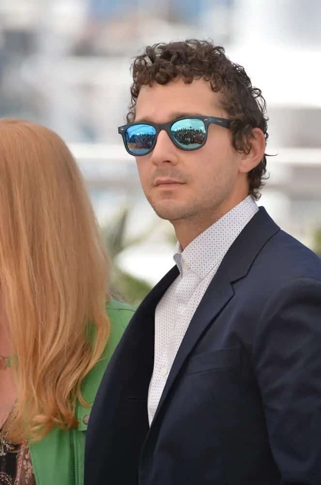 Shia Labeouf was looking fresh and relaxed last May 15, 2016 at the "American Honey" photocall during the 69th annual Cannes Film Festival. He was wearing a smart casual getup with shades to match his carefree short beach curls.
