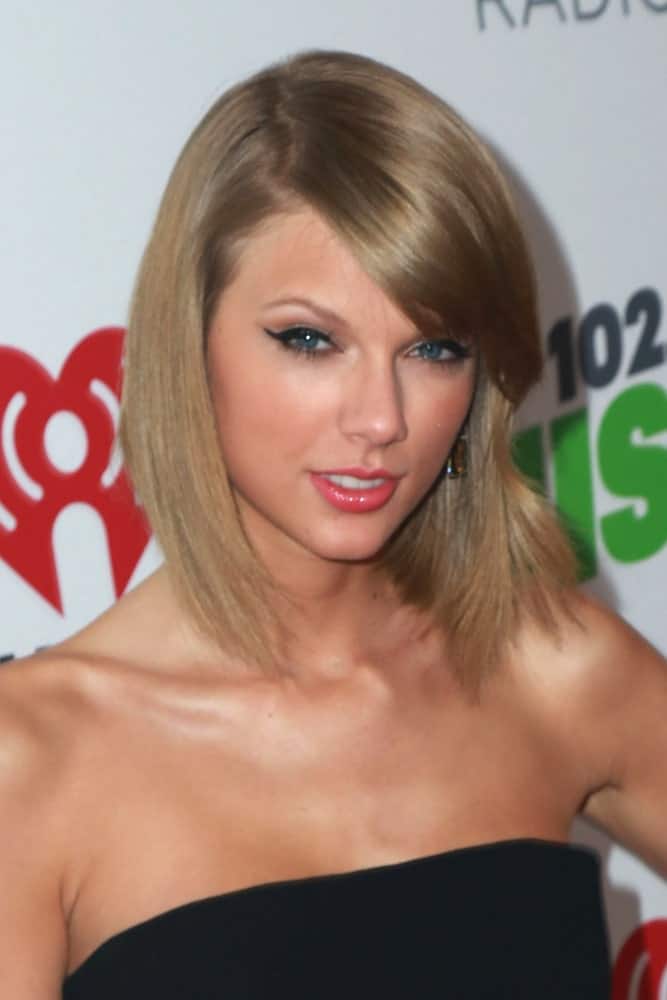 During the KIIS FM's Jingle Ball 2014 at the Staples Center on December 5th, Taylor Swift showed off her long bob cut with side bangs.