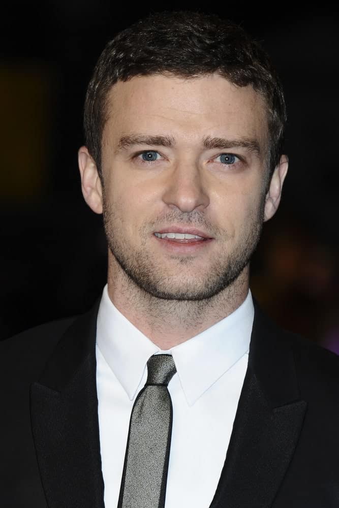The actor attended the premiere of "In Time" in his classic short wavy hair with a bit of five o'clock shadow to complement the black suit last October 31, 2011, at the Curzon Mayfair cinema, London.