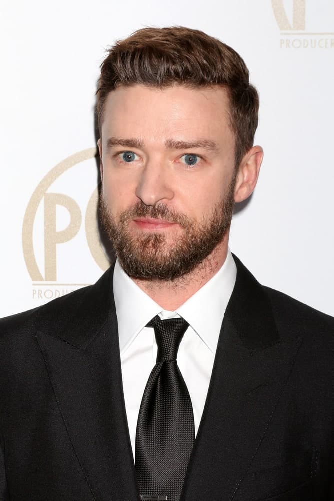 Justin Timberlake attended the 2017 Producers Guild Awards in a sophisticated suit and tie, with his hair slightly brushed to one side and a slightly trimmed beard.