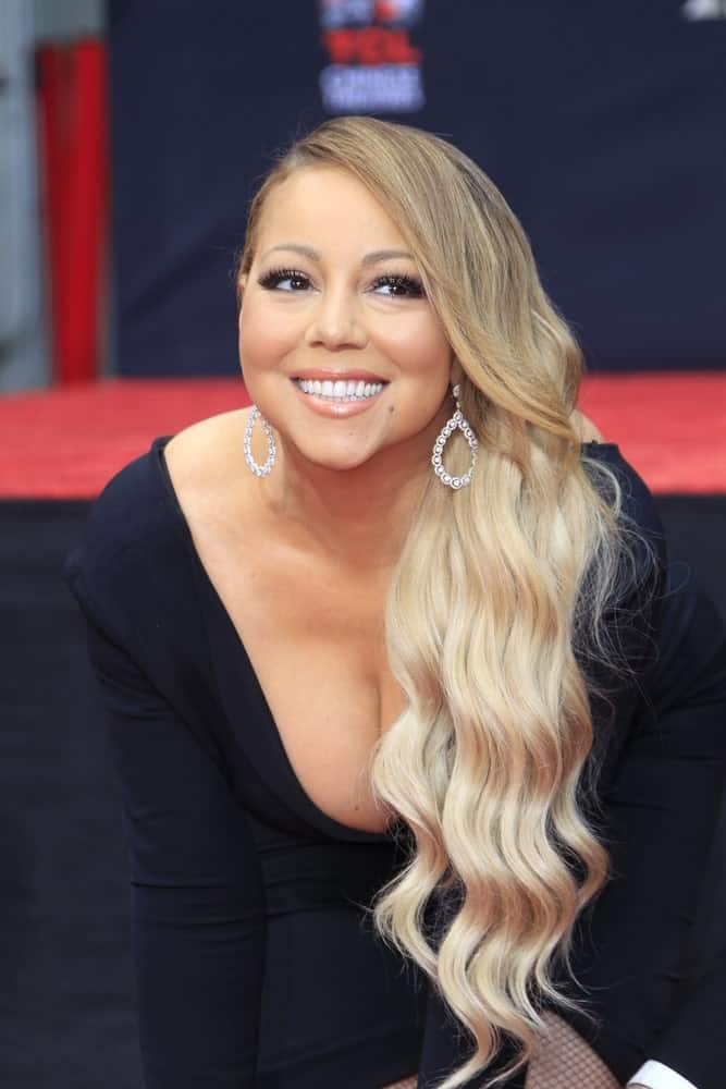 Mariah Carey had her long ombre beach waves swept to one side perfectly complemented by her diamond earrings during her Hand and Footprint Ceremony at the TCL Chinese Theater IMAX last November 1, 2017.