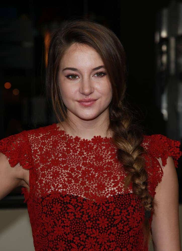 Shailene Woodley attended the Director's Guild Awards 2012 on January 28, 2012, in Hollywood, CA. She wore an embroidered red floral dress that topped it with a brunette side-swept hairstyle that has a fishtail braid.
