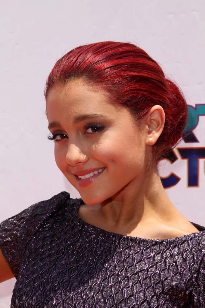 Ariana Grande in a neat low bun at the iParty with Victorious Premiere Event held on June 4, 2011. She paired it with a textured dress and a natural-looking makeup.