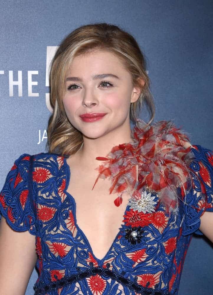 Chloe Grace Moretz was at The 5th Wave Special Screening on January 14, 2016, in Los Angeles, CA. She wore a colorful dress to pair with her low bun hairstyle that has highlights and long side-swept bangs.