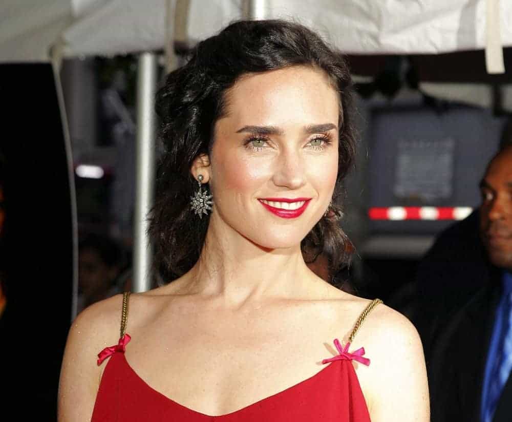 Jennifer Connelly wore a Viktor & Rolf dress at the Touchstone Pictures Dark Water Premiere at Clearview's Chelsea West Cinemas in New York, NY on June 27, 2005. She paired this with a curly and dark half-up hairstyle that has a slight tousle.