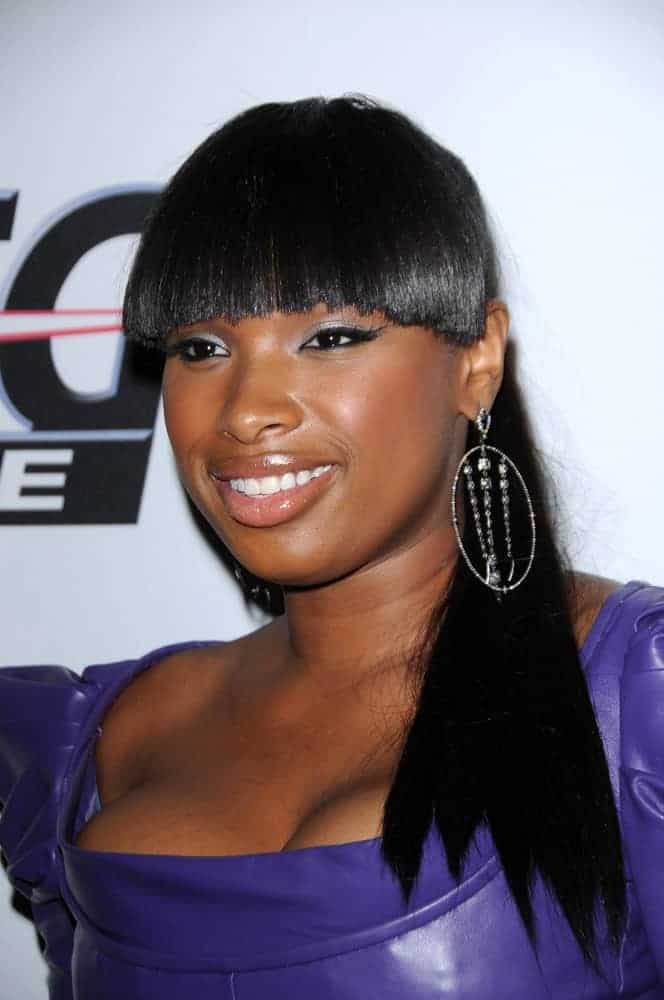 Jennifer Hudson attended The Recording Academy and Clive Davis Present The 2010 Pre-Grammy Gala - Salute To Icons, Beverly Hilton Hotel, Beverly Hills, CA on January 30, 2010. She was seen wearing a purple leather dress with her long raven ponytail hairstyle with blunt bangs.