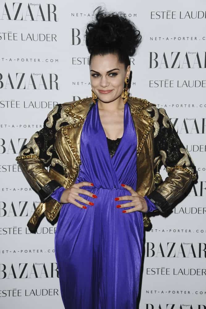 Jessie J went for a beehive hairstyle with her large hair bun at the top of her head. This is paired with a blue romper and gold leather jacket for the Harpers Bazaar Women of the Year Awards 2011 in London last November 7, 2011.