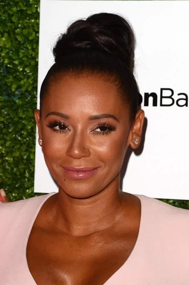 Mel B is pretty in a light pink dress with tresses piled in a big bun on top of her head as she attends the 2016 Ladylike Women of Excellence Awards Gala on June 4, 2016.