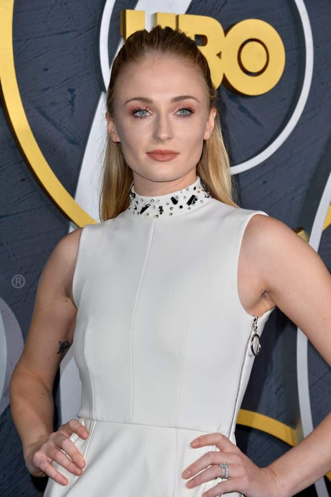 Sophie Turner struck a pose while sporting her slick half upstyle during the HBO post-Emmy Party at the Pacific Design Centre held on September 23, 2019.