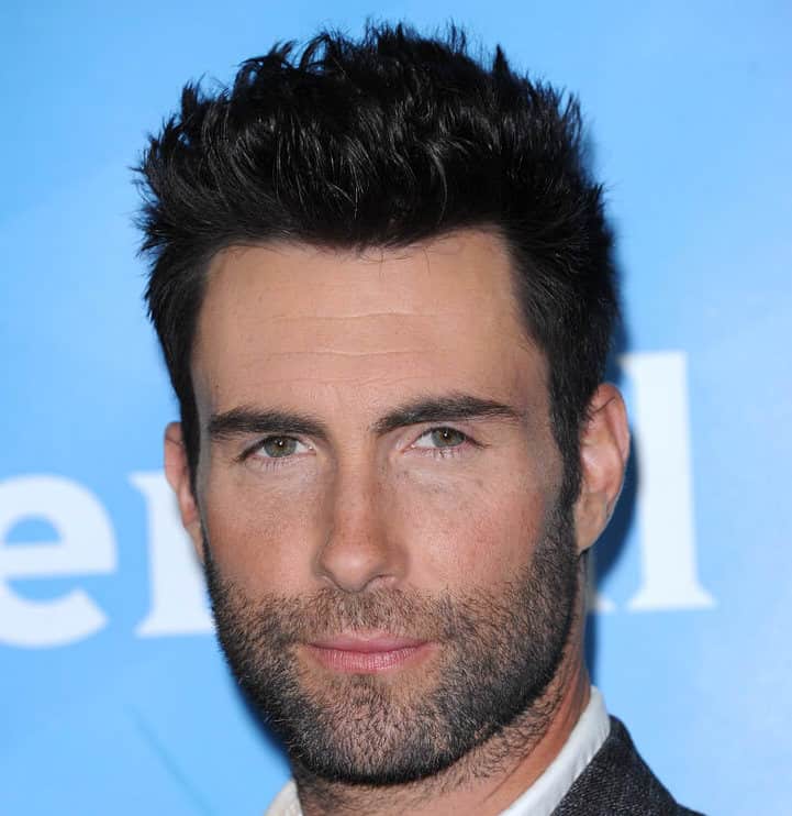 Adam Levine sporting spiked hairstyle