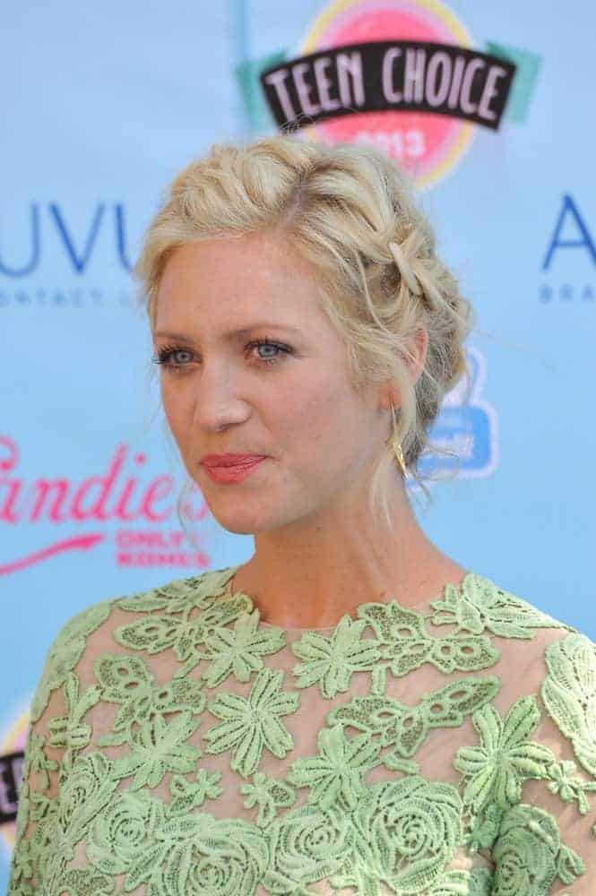 Brittany Snow was at the 2013 Teen Choice Awards at the Gibson Amphitheatre, Universal City, Hollywood on August 11, 2013 in Los Angeles, CA. She was seen wearing an embroidered sheer dress to pair with her messy blonde bun hairstyle incorporated with braids.