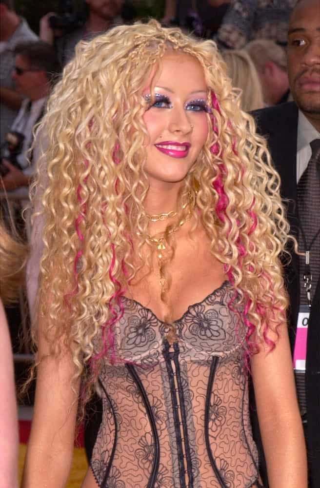 Christina Aguilera showcased a bold hairstyle with these curls and braids combination accentuated with magenta streaks during the MTV Movie Awards held on June 2, 2001.