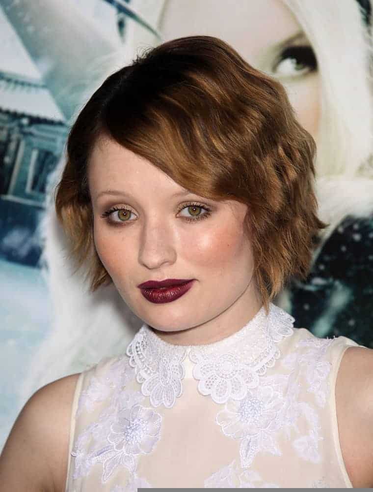 Emily Browning attended the "Sucker Punch" World Premiere on March 23, 2011, in Hollywood, CA. She was lovely in a white sheer dress and topped it with a pixie brunette hairstyle with curls and long side-swept bangs.