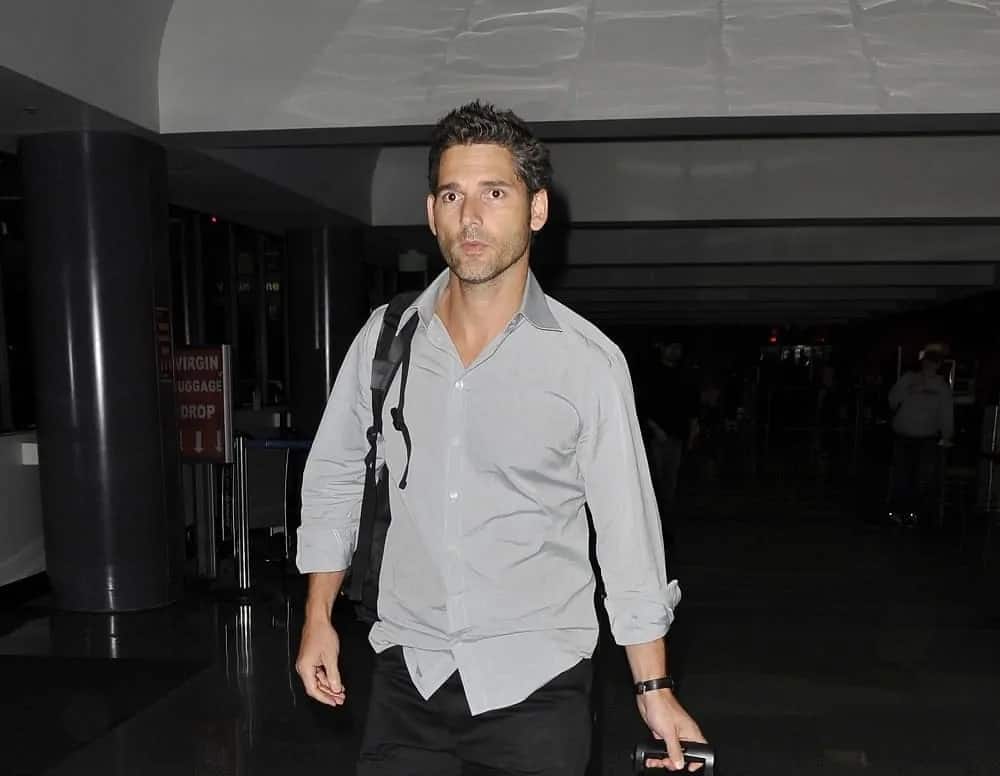 Australian actor Eric Bana was seen making his way thru LAX (Los Angeles Airport) carrying his luggage on February 6, 2010, in Los Angeles, California. He wore a gray button-down shirt with his short spiked crew cut hairstyle.