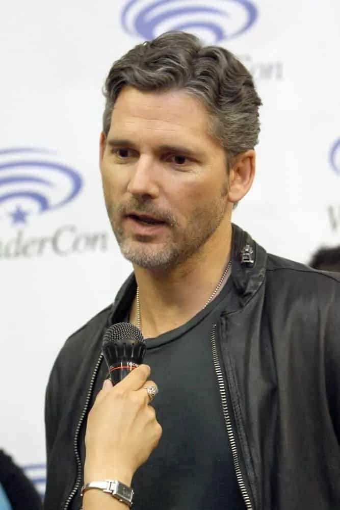 Eric Bana was at the 2014 Annual Wondercon press room for "Deliver Us From Evil" on April 19, 2014 in Anaheim, CA. He wore a leather jacket with his gray short curly hairstyle that is side-parted.