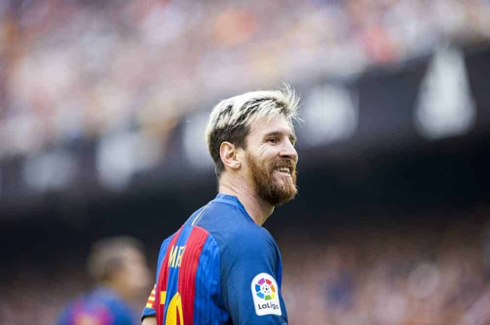 Messi played at the BBVA League match between Valencia C.F. and Barcelona at Mestalla Stadium on October 22, 2016 in Valencia, Spain. He was seen playing with a full beard and a blond dyed side-parted and tousled hairstyle.