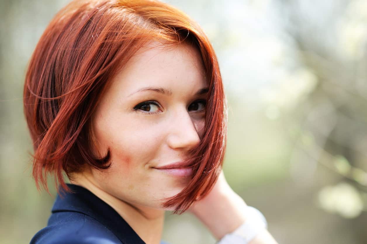 Woman with short red hair