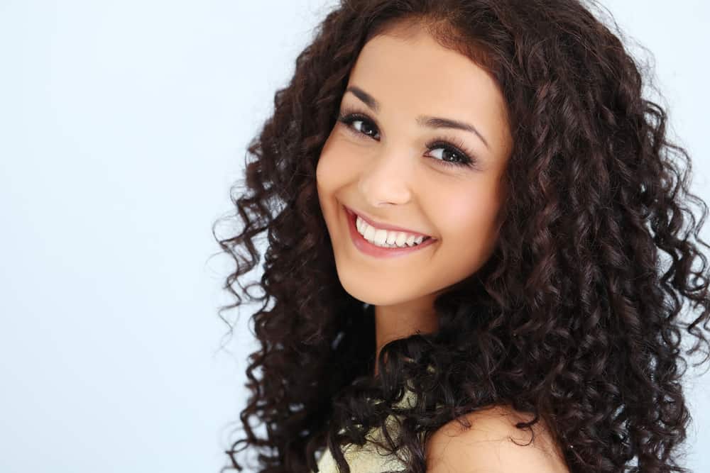 Woman with curly hair.