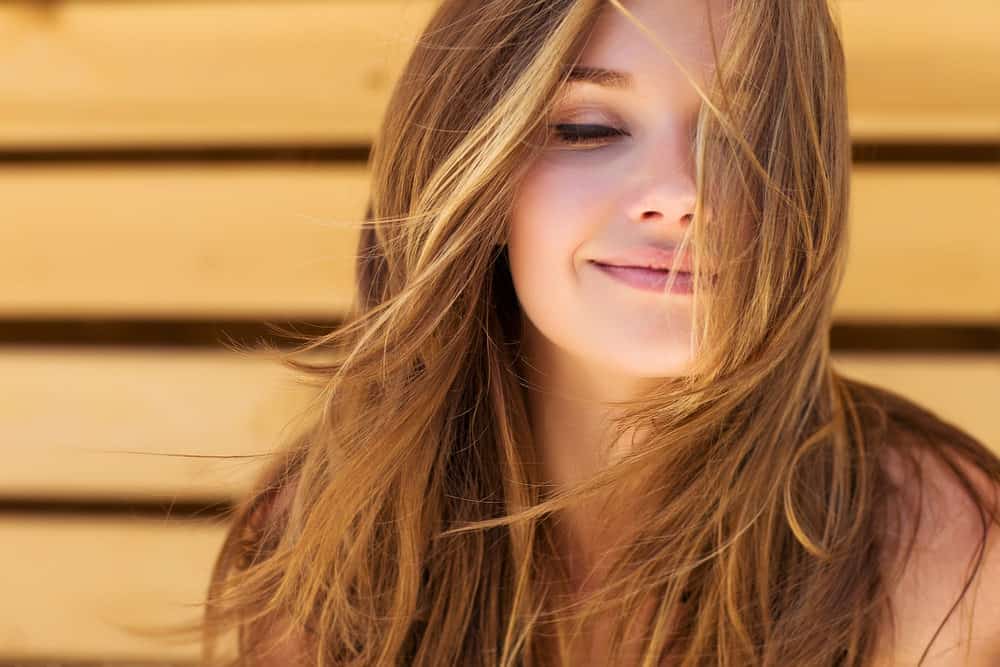 Woman with long light brown hair
