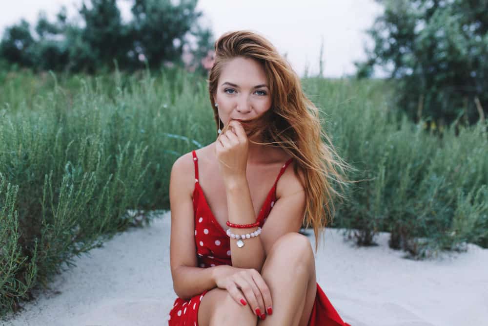 Woman with sandy blonde hair on the beach