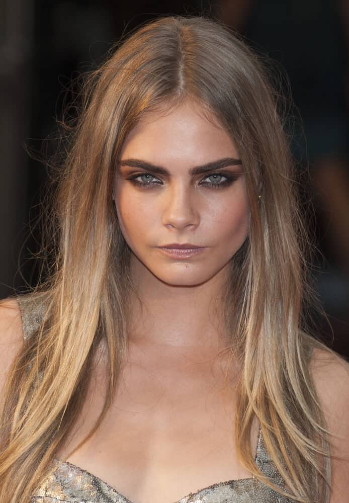 Cara Delevigne looking fierce with her dirty blonde hair.