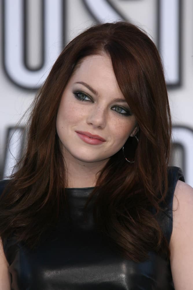 Emma Stone with deep, chestnut brown hair.