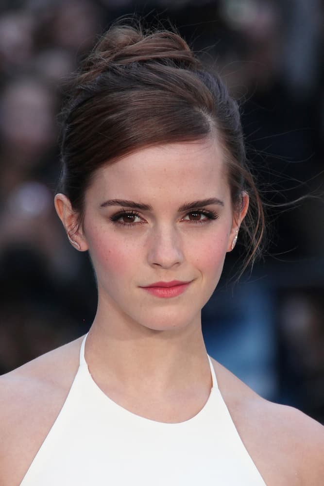 Emma Watson in a simple and formal updo.