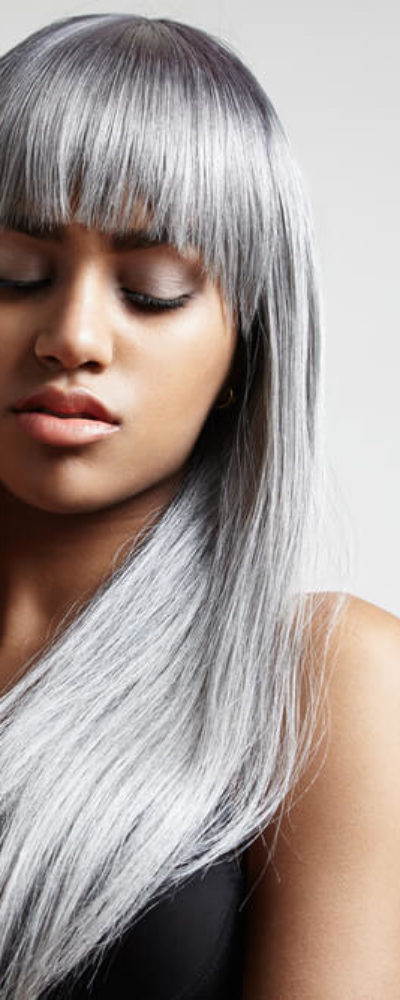 Long hair with full bangs in gray.