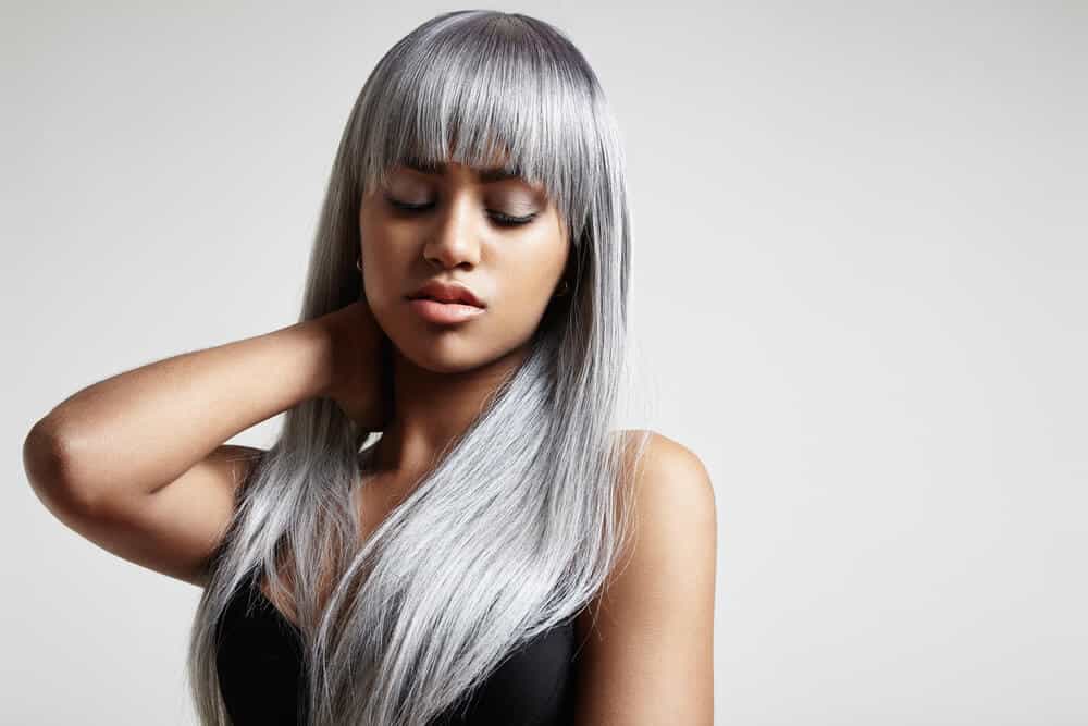 Long hair with full bangs in gray.