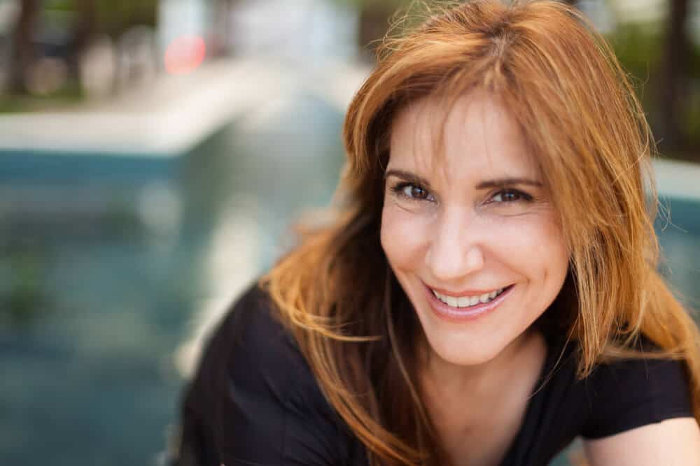 A beautiful middle-aged woman with Auburn hair.